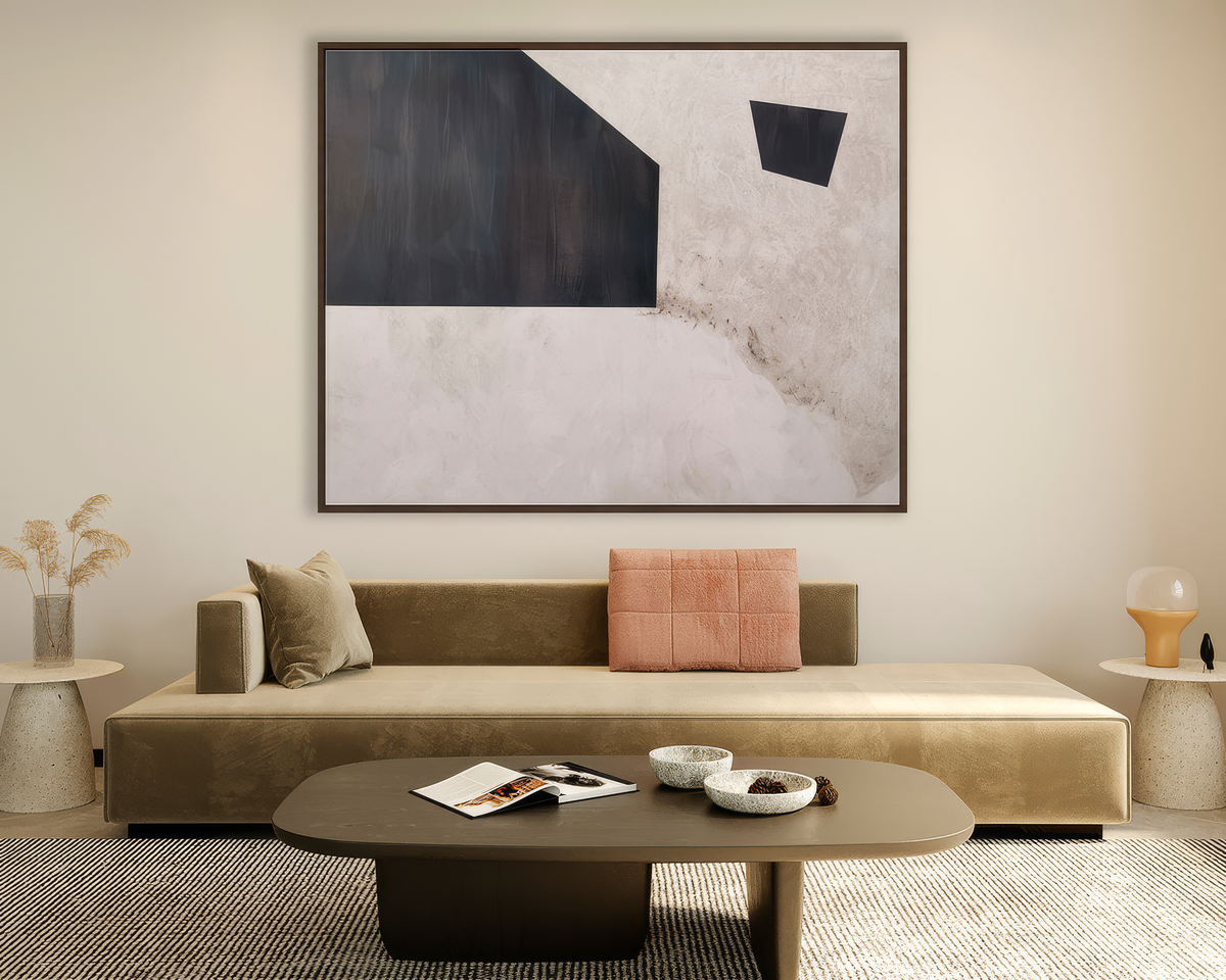 Large abstract canvas artwork in charcoal and plaster white above a low velvet sofa, Kunal Trehan wall art