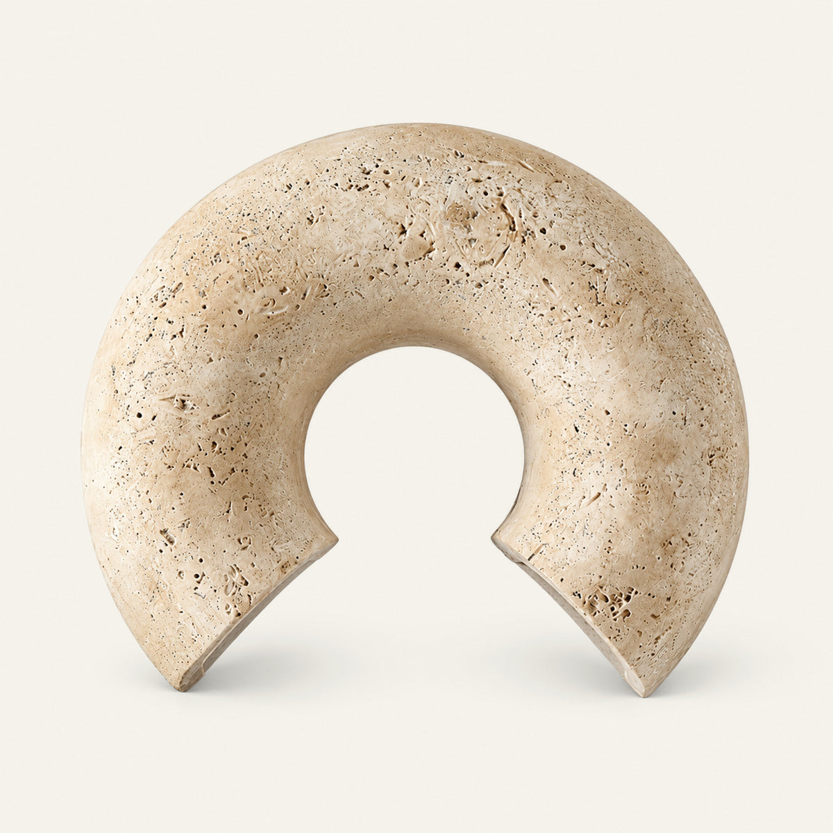 The Arco travertine wall light, a stone arch, unlit