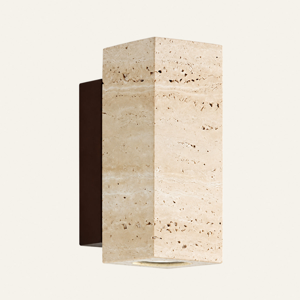 The Blocco travertine wall light with a walnut mount