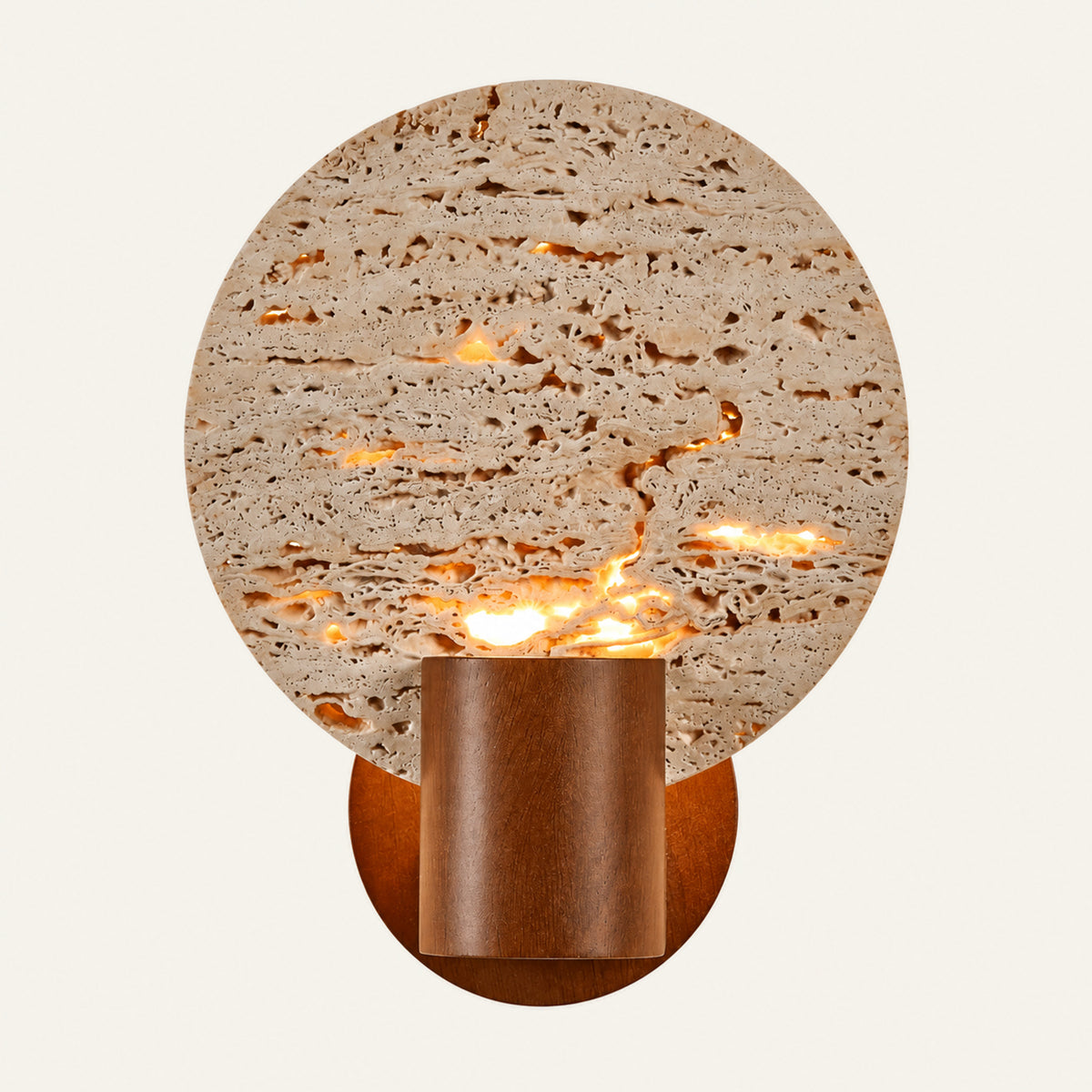The Calice travertine wall light, a round stone disc with a walnut cup