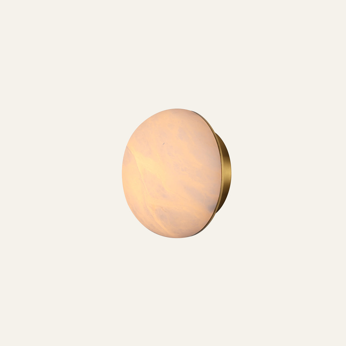 The Conca alabaster wall light in brass, lit