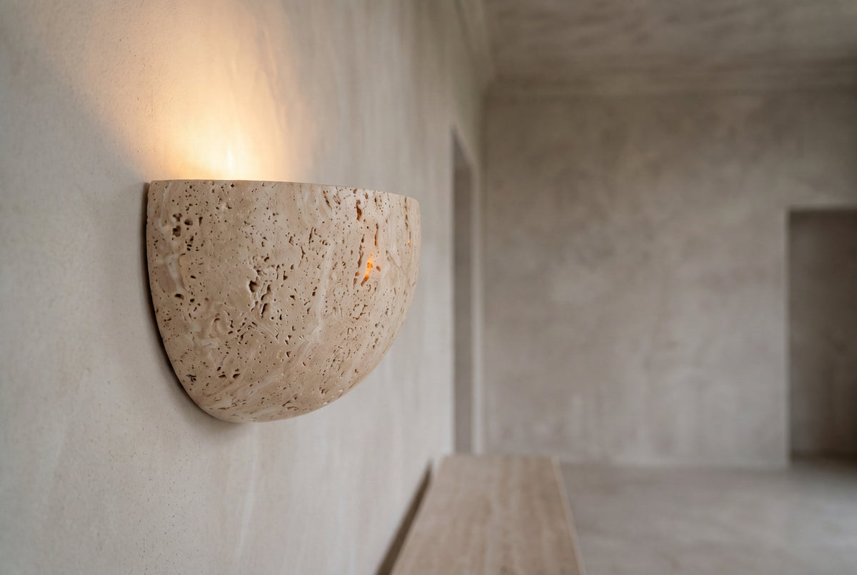 The Conchiglia Travertine Wall Light, lifestyle close-up