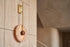 The Disco Travertine Wall Light, lifestyle close-up
