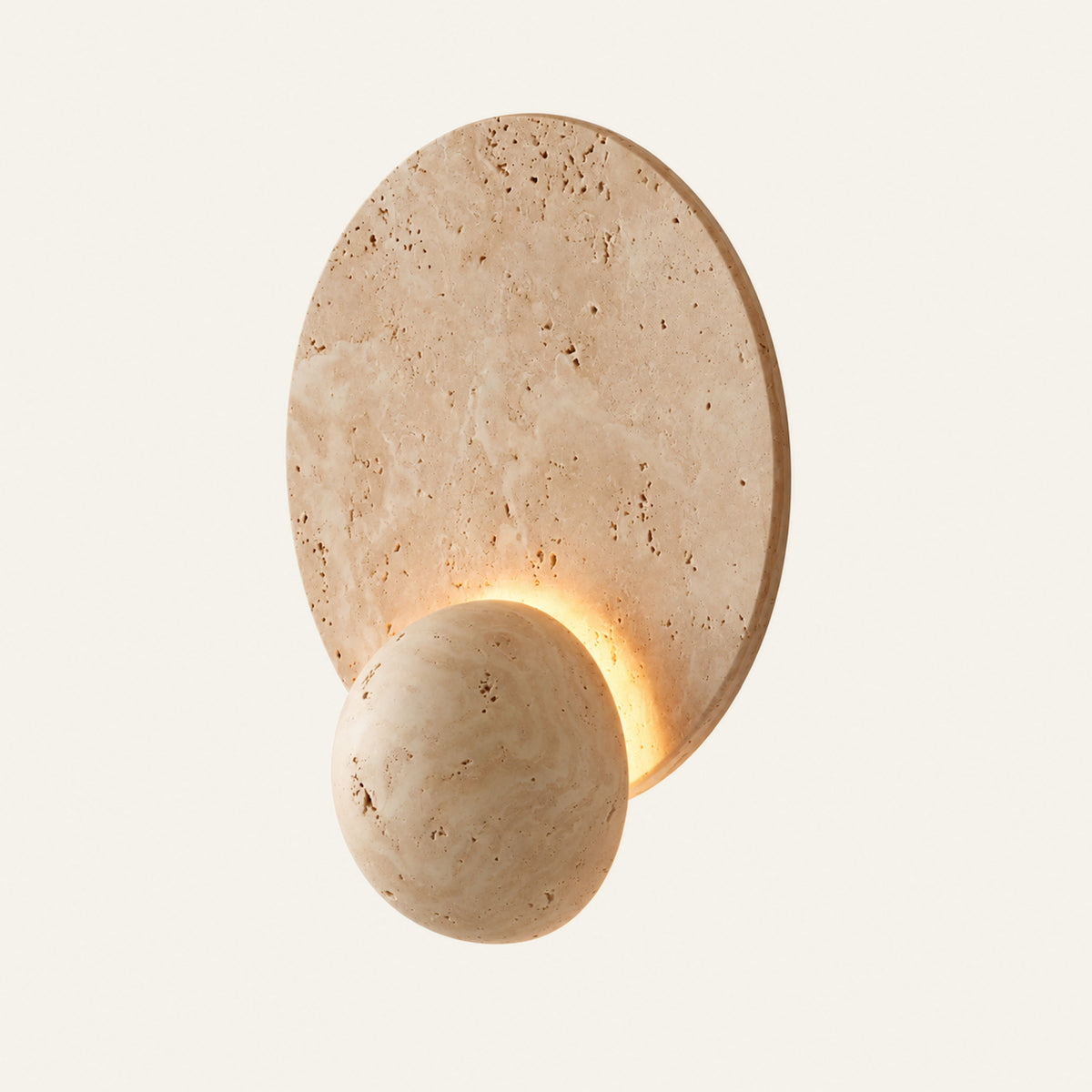 The Doppio travertine wall light, a small stone sphere against a larger disc