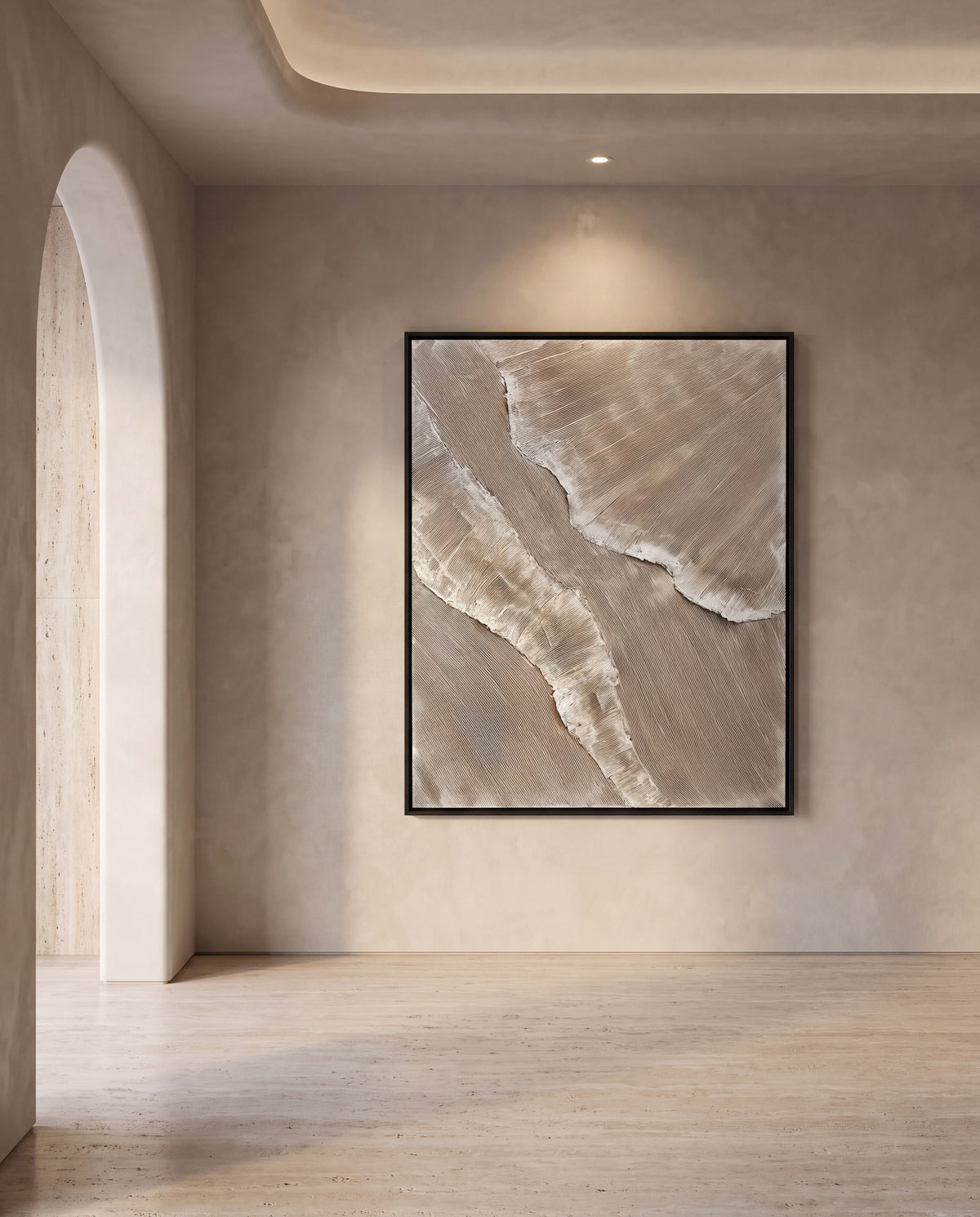 Falaise canvas artwork in a black frame on a plaster wall