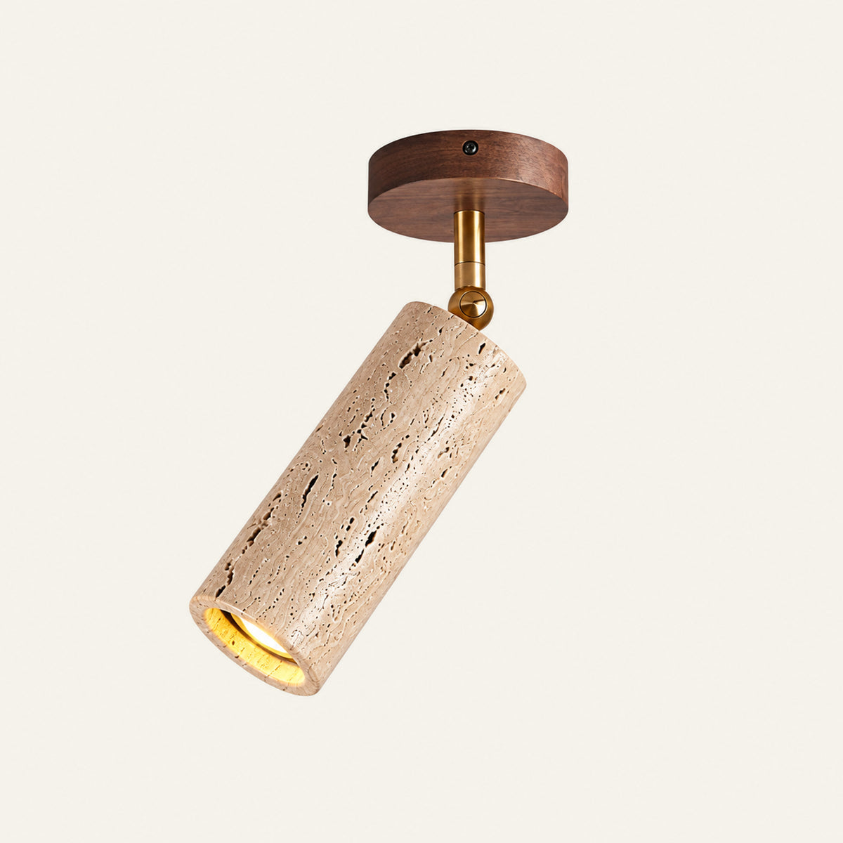 The Faretto travertine wall light with a walnut base