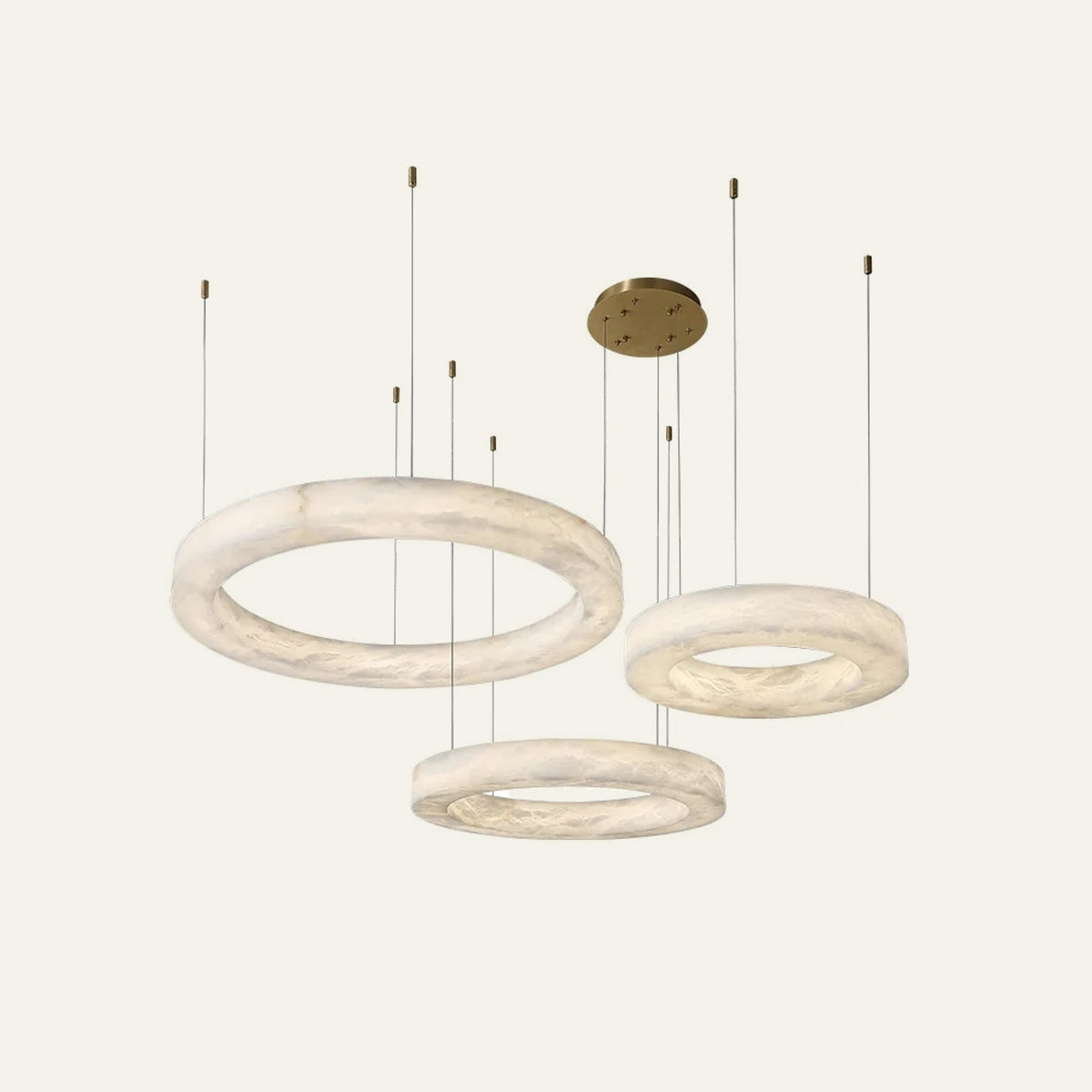 The Fascia alabaster chandelier, three tiers staggered, in brass
