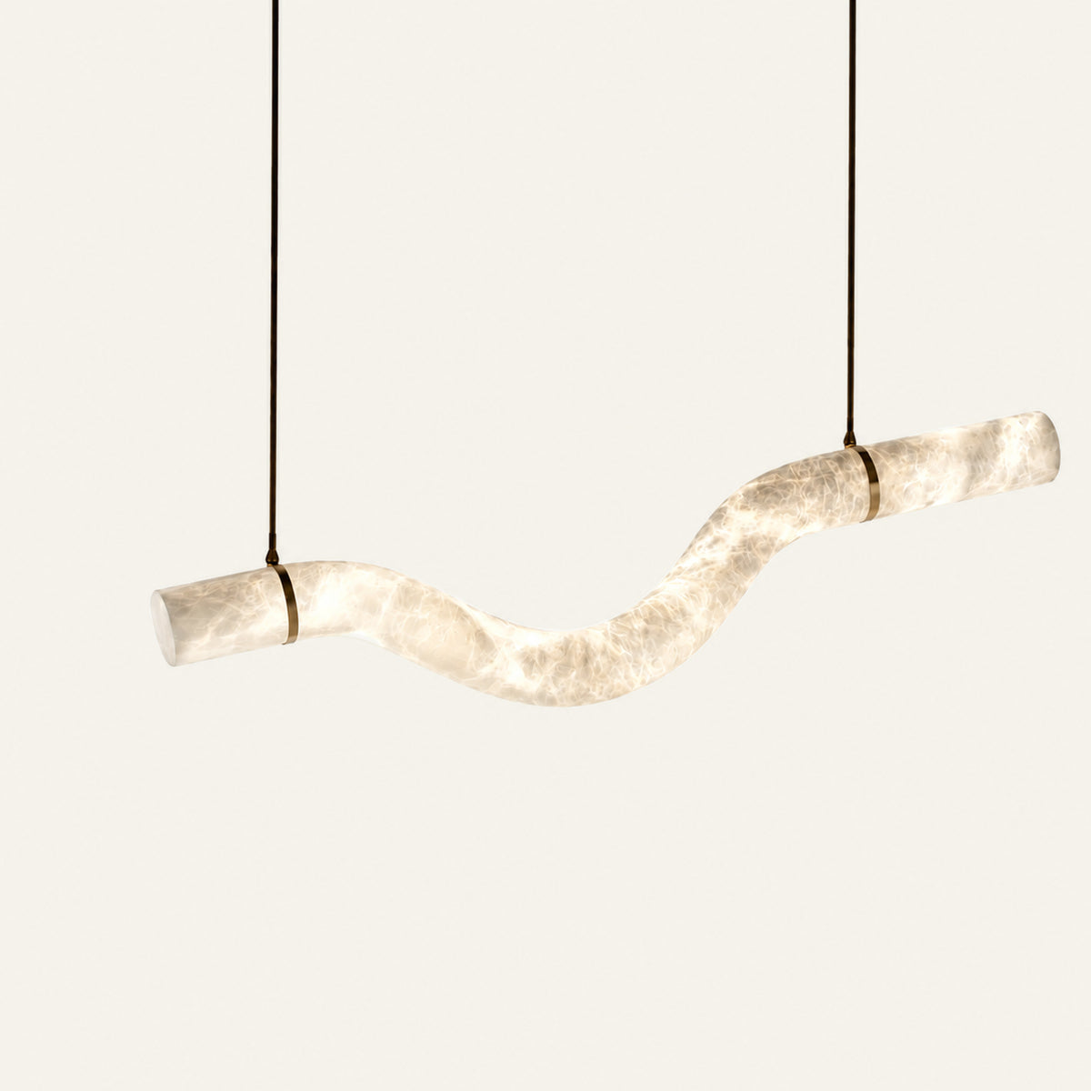 The Fiume alabaster linear pendant light close-up of the curved alabaster