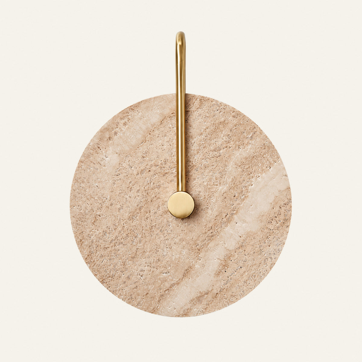 The Gancio travertine wall light, a round stone disc with a curved brass arm