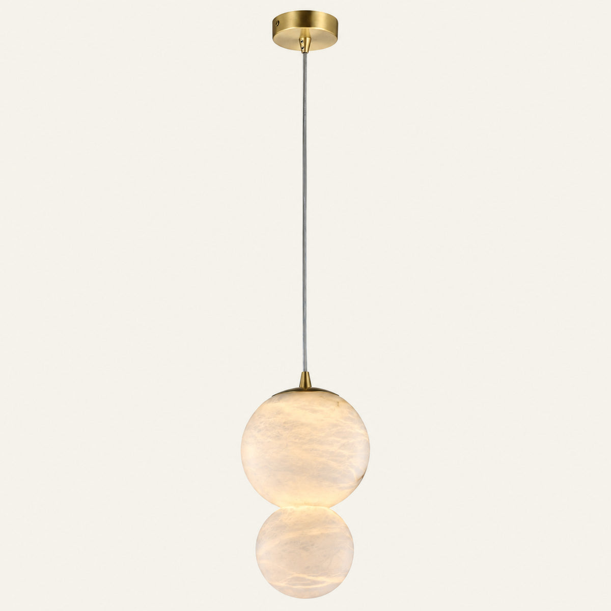 The Gemella alabaster pendant light, two stacked spheres Ø12cm and Ø10cm in brass