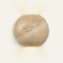 The Globo travertine wall light, a stone globe washing light up and down