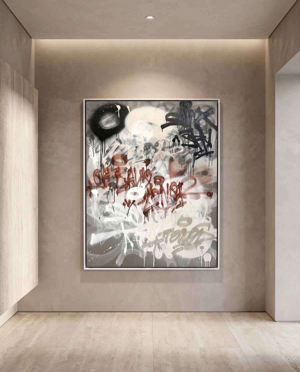 Grafico Brut canvas artwork in a white frame on a plaster wall
