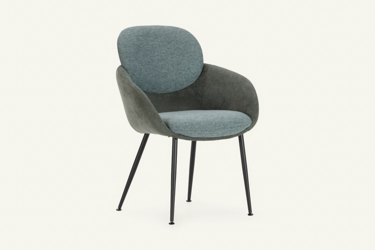 The Arona Armchair in forest green, upholstered tub armchair on slim black legs, studio view
