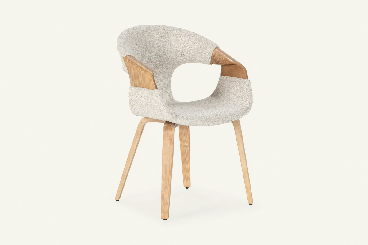 The Ascoli Dining Chair, ivory dining chair with an open curved oak back, studio view