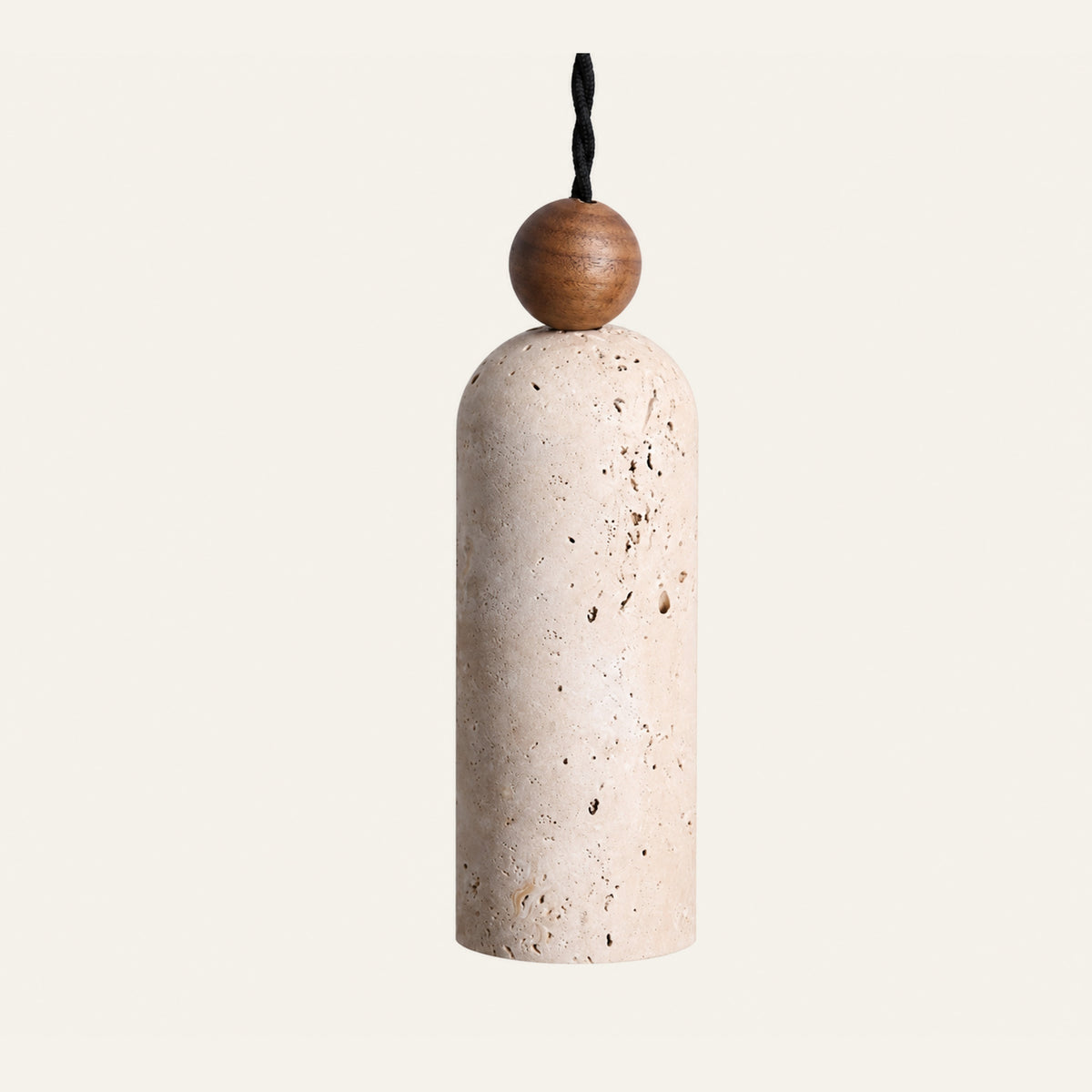The Bacchetta travertine pendant light, a slim cream stone cylinder with a round wood bead on a black twisted cable