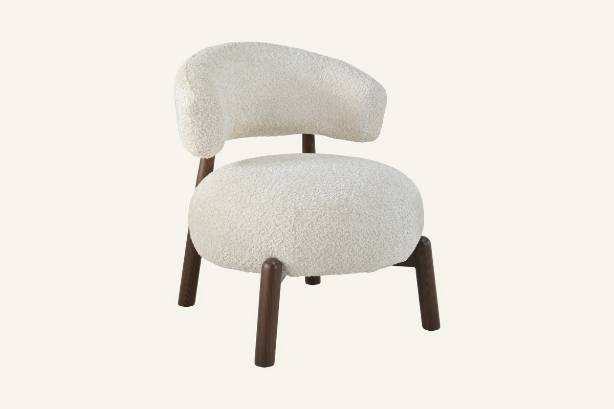 The Bardolino Armchair in off-white, curved-back armchair in textured fabric, studio view