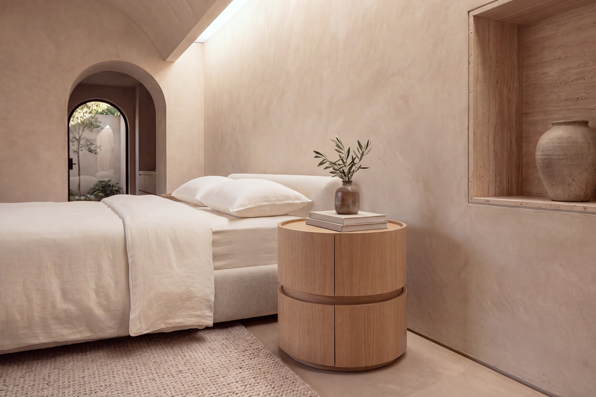 The Bellano Bedside Table in oak beside the Positano bed in a barrel-vaulted plaster bedroom