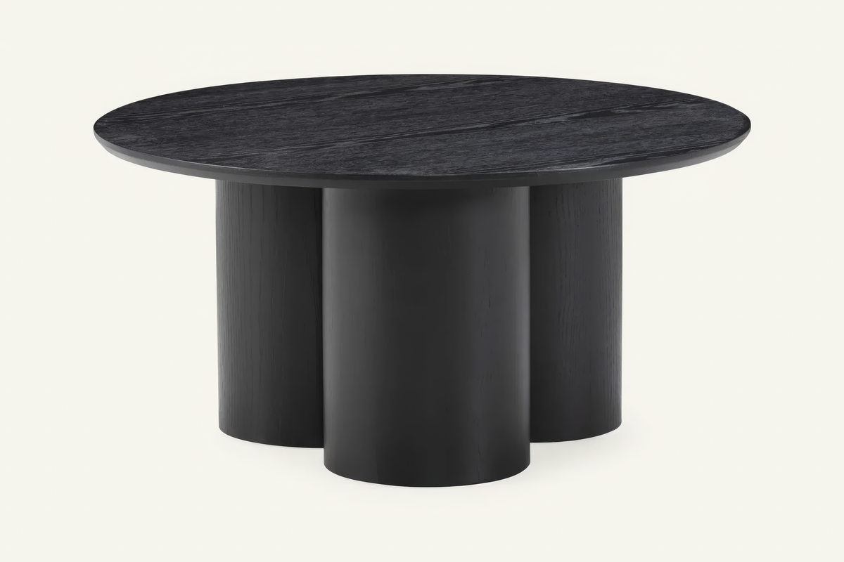 The Bosa Coffee Table in black, round coffee table on a clustered column base, studio view