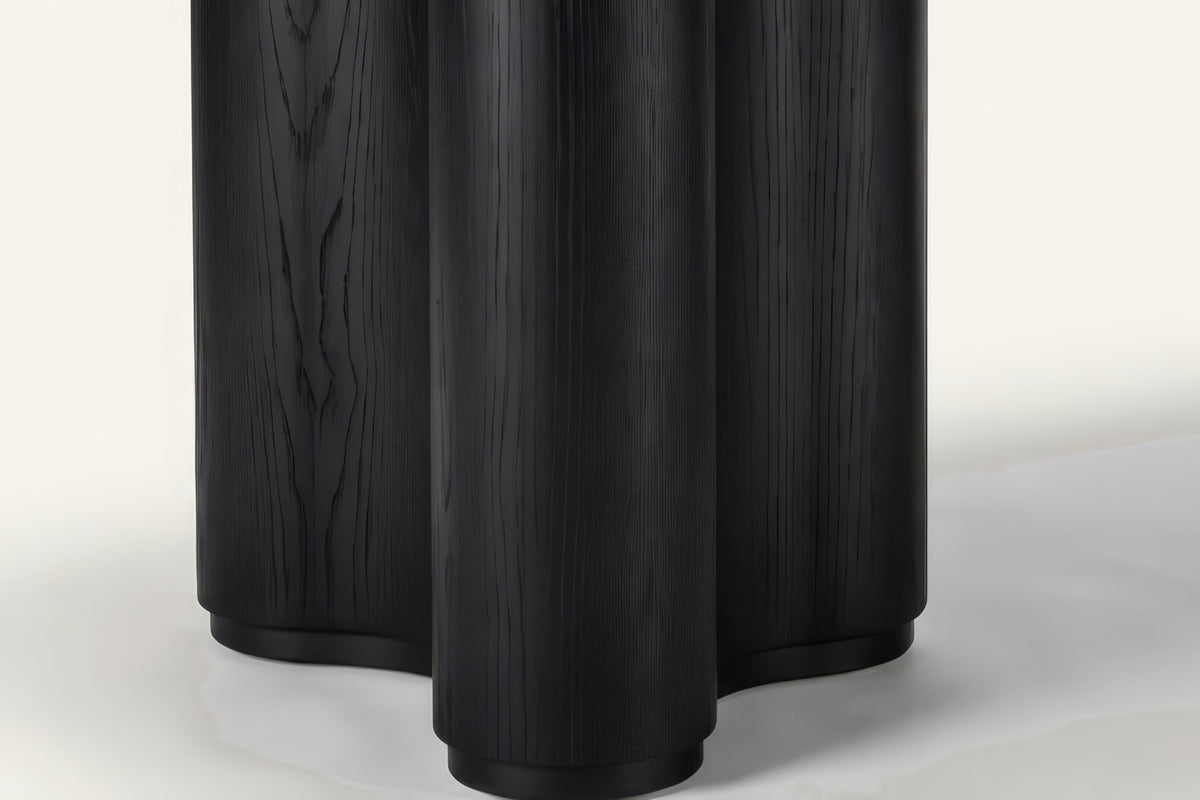 The Brindisi Dining Table, close-up of the fluted wave pedestal in black oak