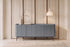 The Camogli Fluted Sideboard in blue, fluted sideboard with rounded ends, styled in a room