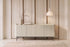 The Camogli Fluted Sideboard in cream, fluted sideboard with rounded ends, styled in a room