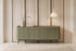 The Camogli Fluted Sideboard in sage, fluted sideboard with rounded ends, styled in a room