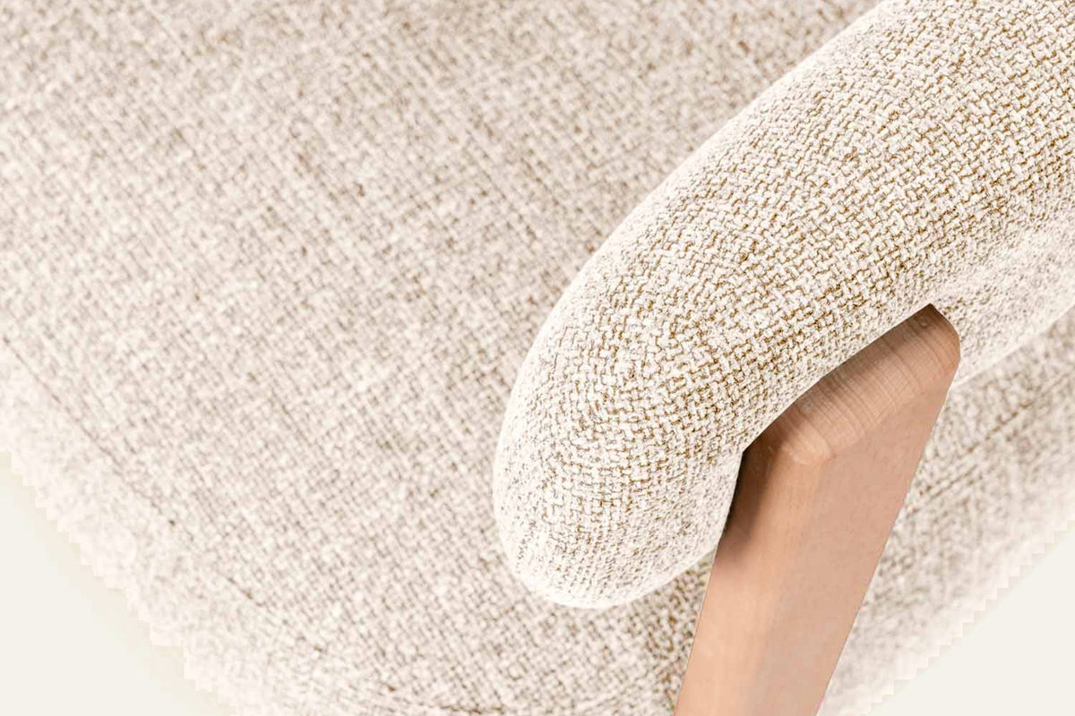 The Cetraro Armchair, close-up of the textured fabric and beech frame