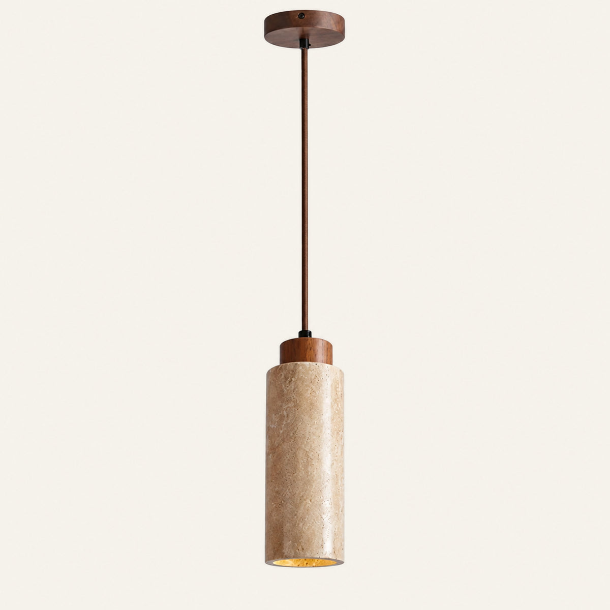 The Pistillo travertine pendant light, a round column with a walnut cap on a slim rod and ceiling plate