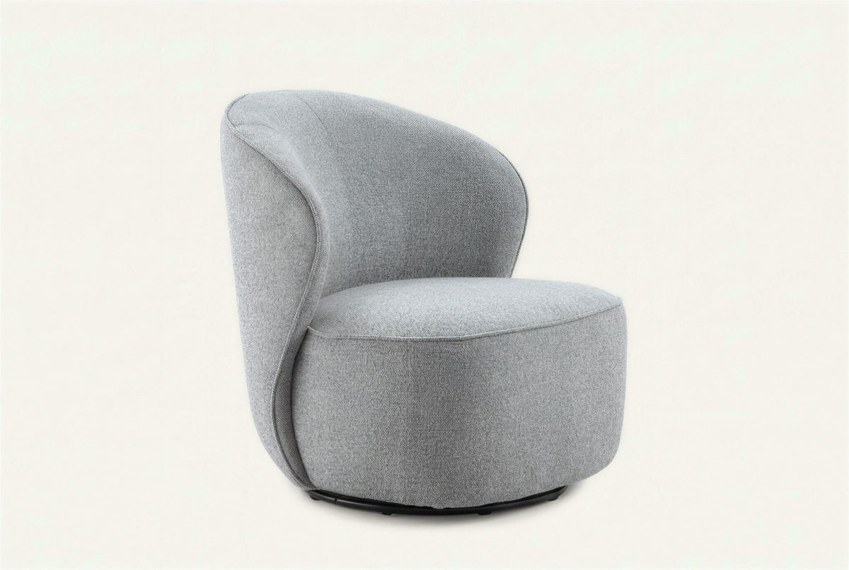 The Erice Accent Chair, tall rounded grey accent chair, studio view