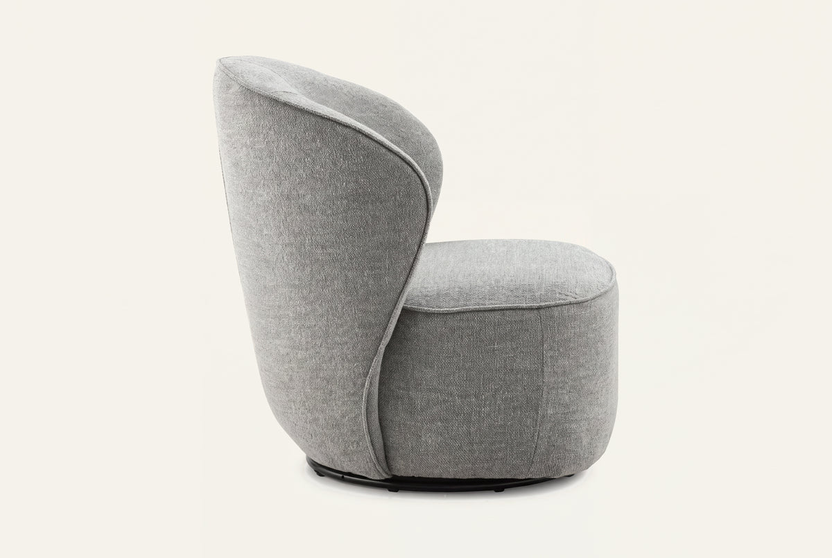 The Erice Accent Chair, tall rounded grey accent chair, studio view