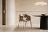 The Fano Dining Chair, dining chair with a curved washed oak back, styled in a room