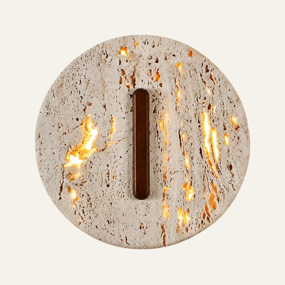 The Fessura travertine wall light, a round stone disc with a vertical wooden slot and warm light showing through its pores