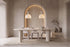 The Gaiole Oval Dining Table, cream concrete-effect oval dining table, styled in a room