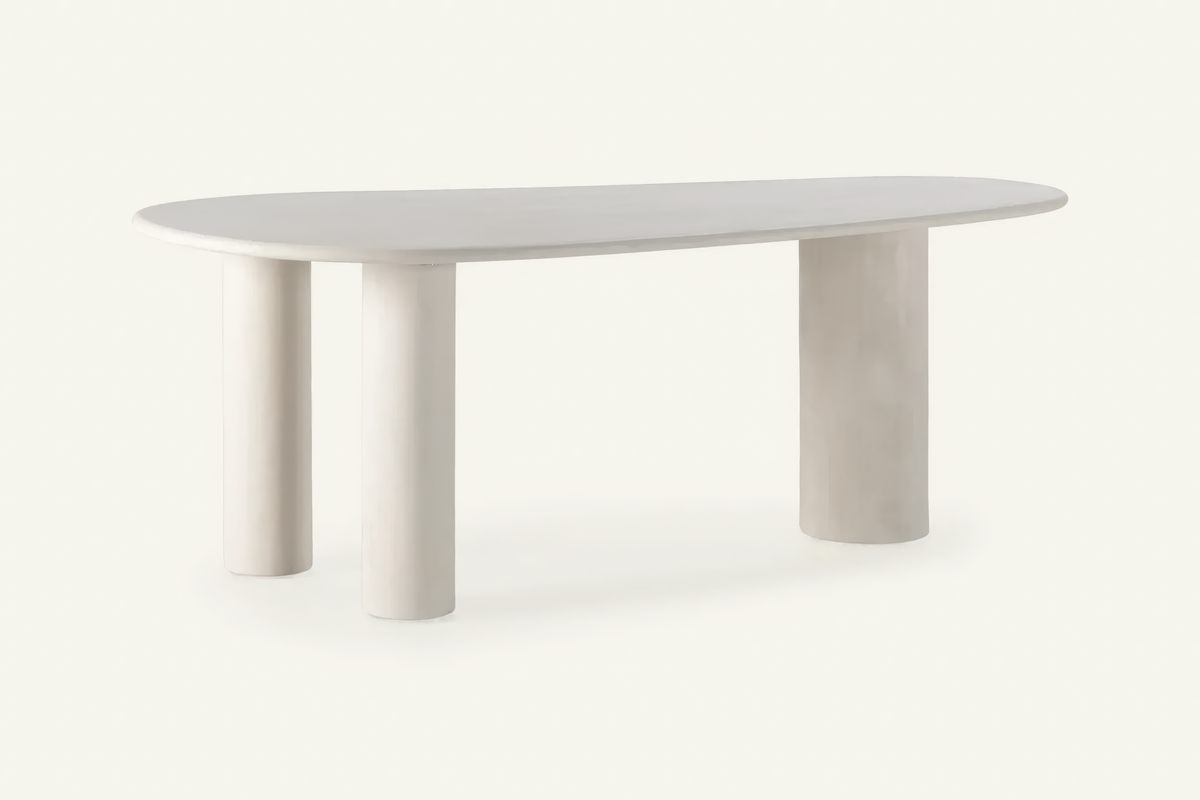 The Gaiole Oval Dining Table, cream concrete-effect oval dining table, studio view