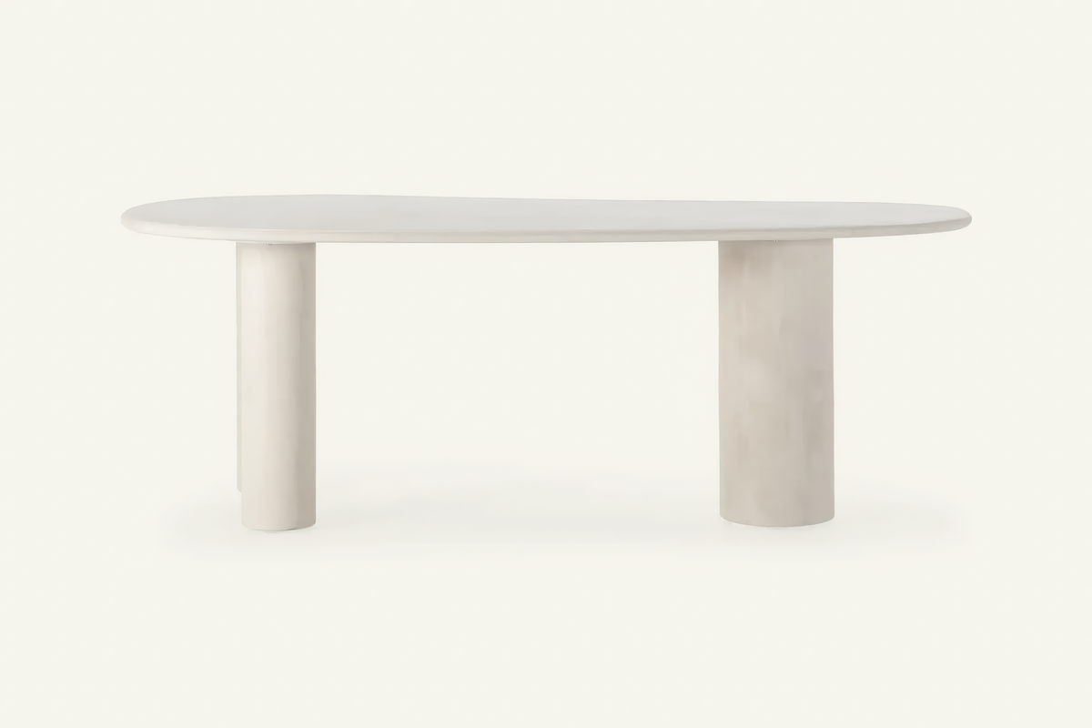 The Gaiole Oval Dining Table, cream concrete-effect oval dining table, studio view