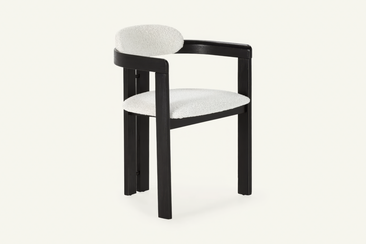 The Garda Dining Armchair, dining armchair with an ivory boucle seat on a black frame, studio view