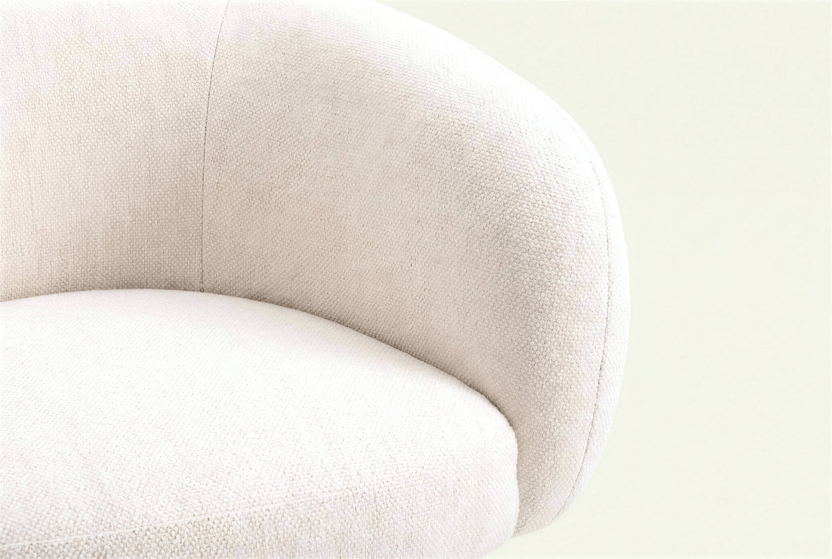 The Mantova Dining Chair in ivory, close-up of the upholstered seat edge