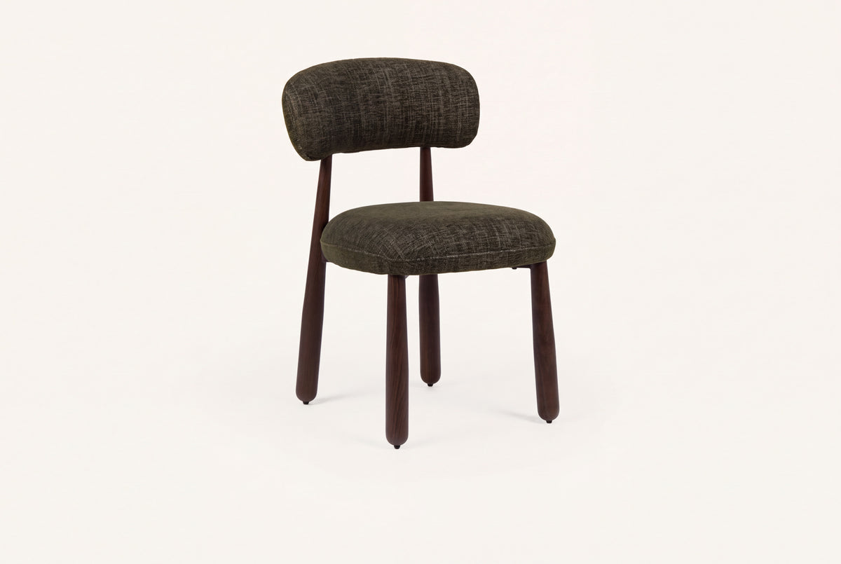 The Mantova Dining Chair in forest green and walnut, upholstered dining chair with a rounded back, studio view