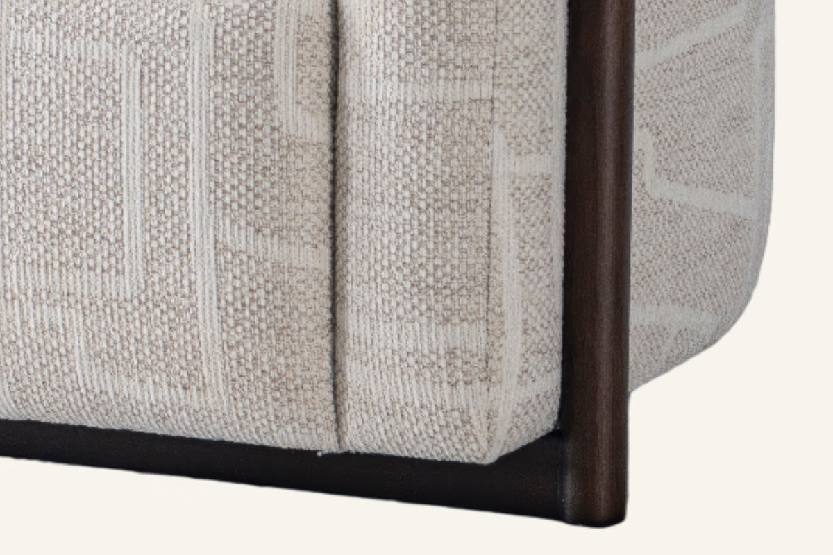 The Modica Armchair, close-up of the cream weave and black metal frame