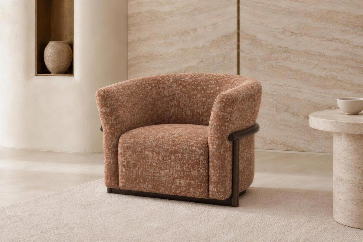 The Modica Armchair in rust with its slim black metal frame