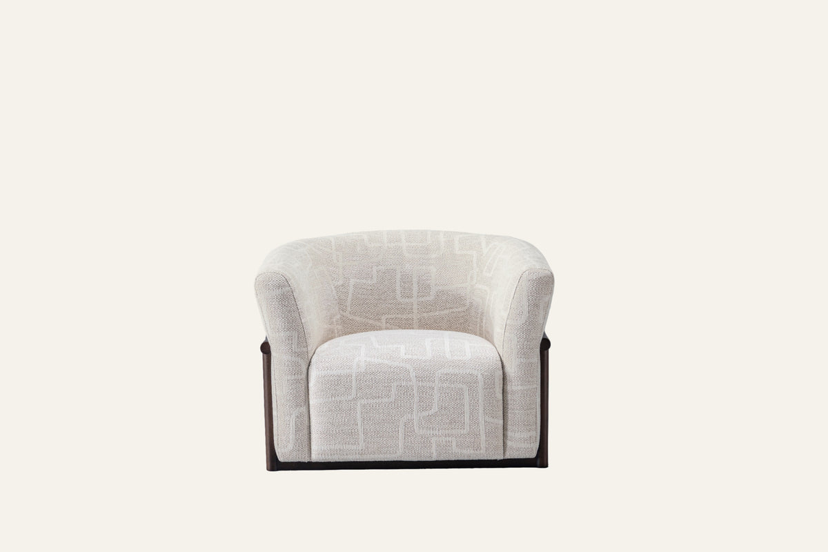 The Modica Armchair in cream, studio view 2