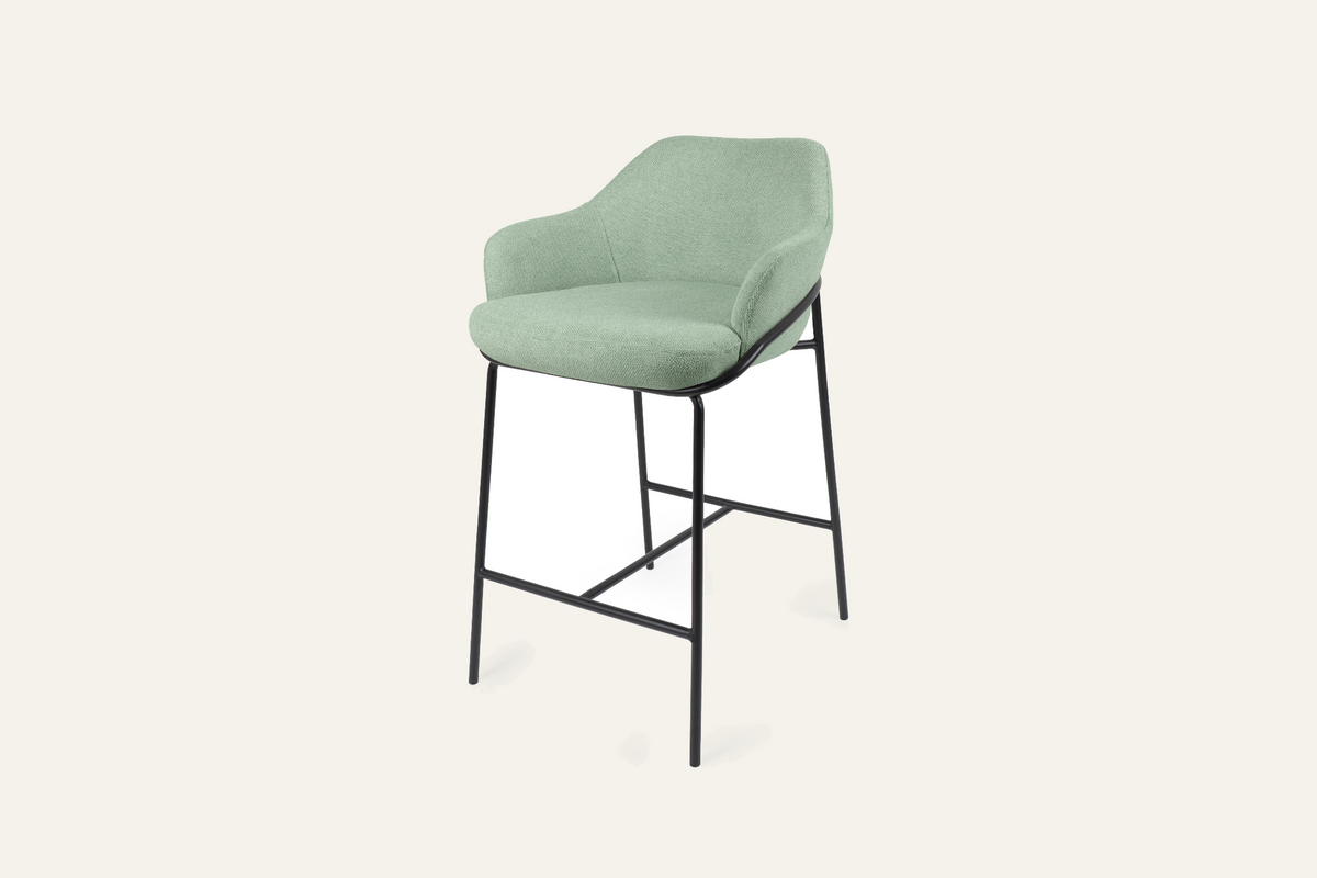 The Moneglia Counter Stool in mint green with black legs