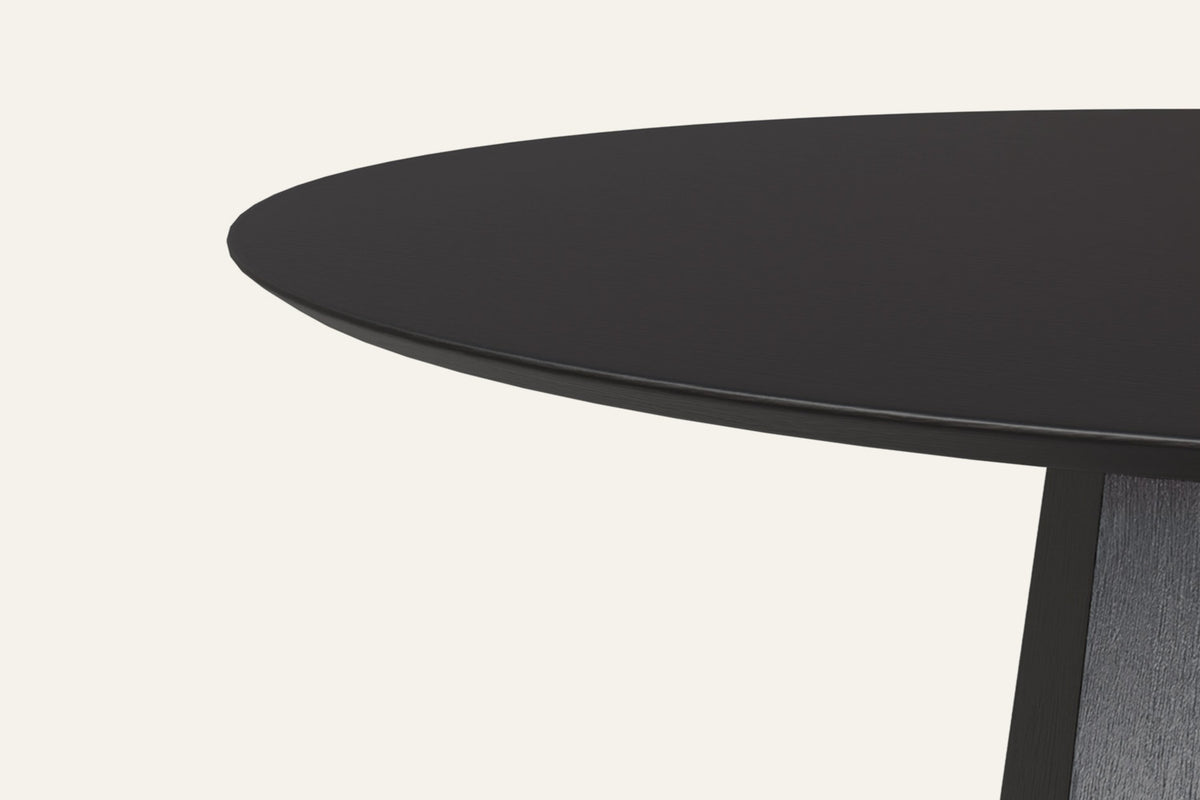 The Monza Round Dining Table, close-up of the black oak grain