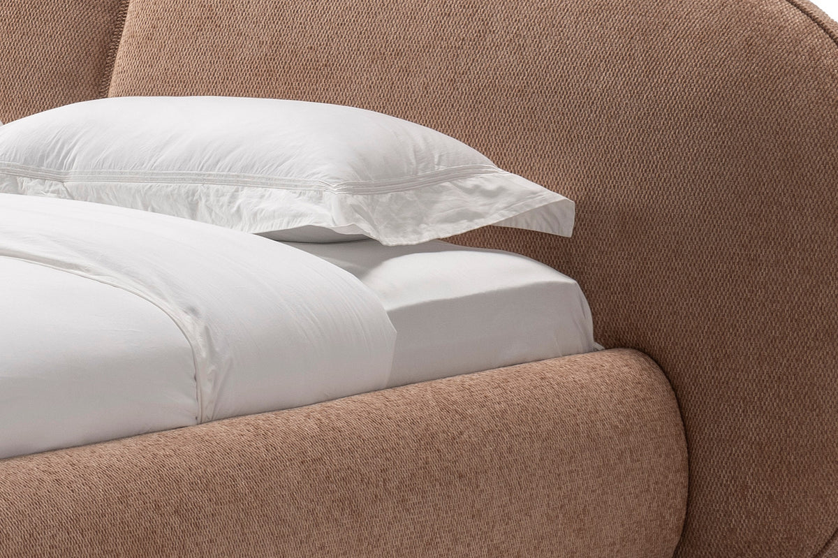 The Noto Bed, close-up of the clay boucle headboard and rounded frame