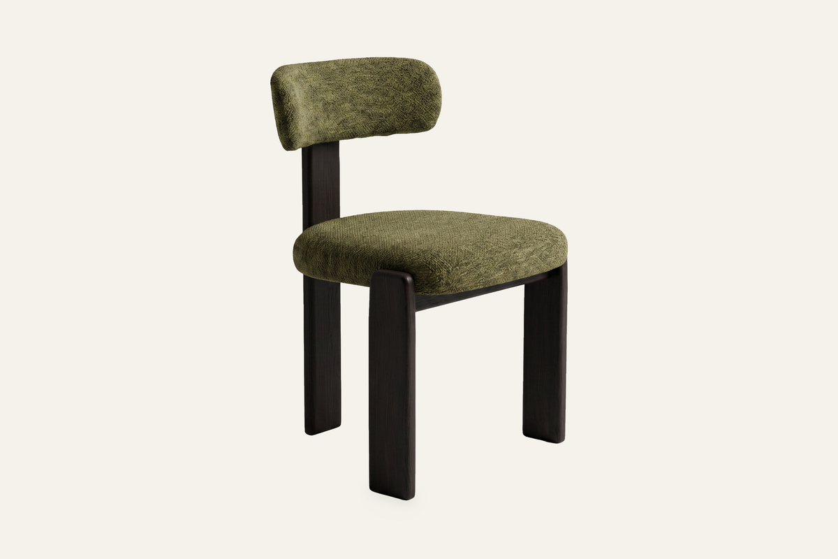 The Orta Dining Chair in green on a walnut frame, upholstered dining chair, studio view