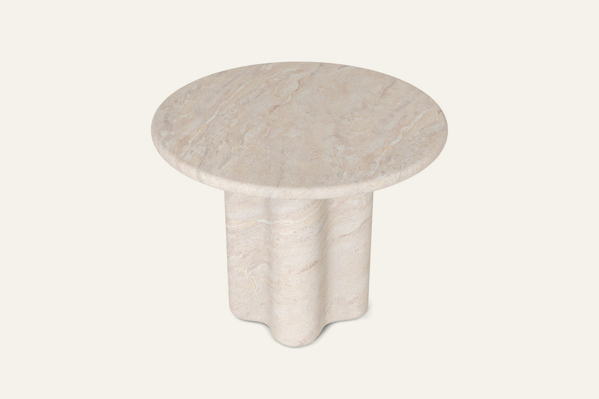 The Ortigia Travertine Finish Round Dining Table, angled view