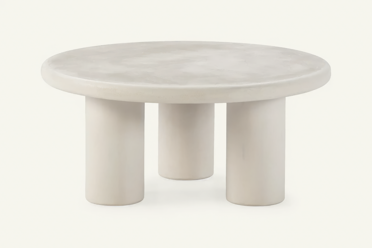 The Otranto Coffee Table, round cream concrete-effect coffee table, studio view