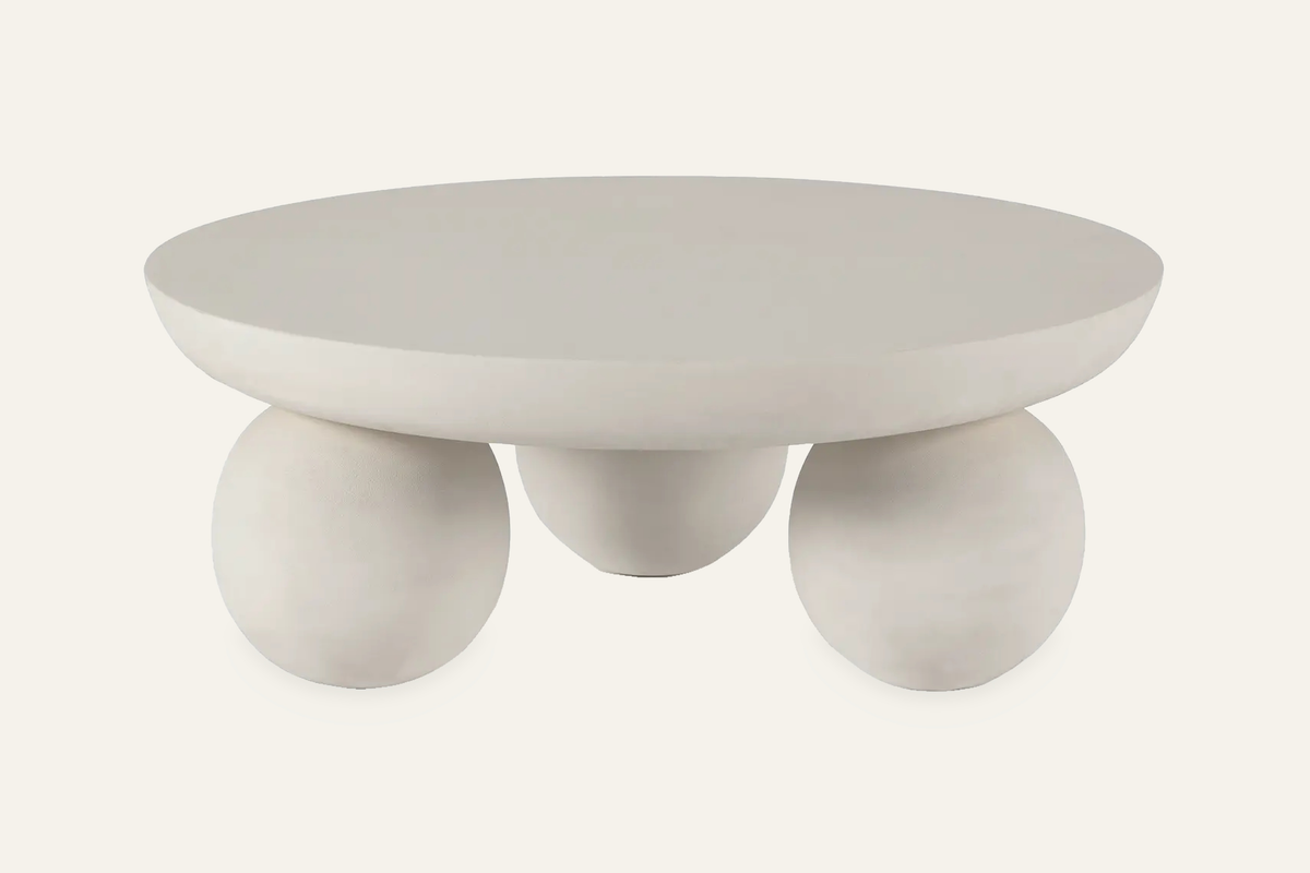 The Panarea Coffee Table in sand, 90 cm, round coffee table on spherical feet, studio view