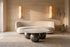 The Pietrasanta Coffee Table, round white marble coffee table on spherical feet, styled in a room