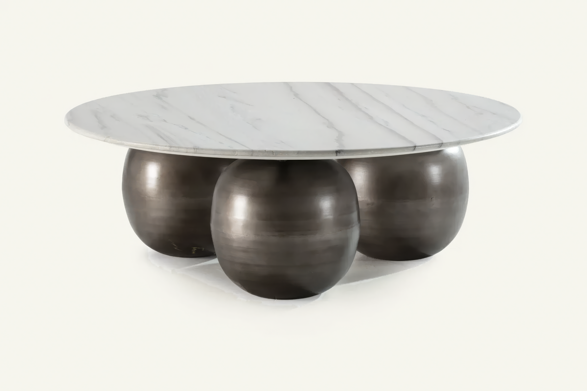 The Pietrasanta Coffee Table, round white marble coffee table on spherical feet, studio view